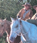 Charlie Bullock oil painting western men on two horses American Plains Artists