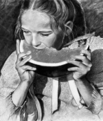 David Dorsey charcoal and acrylic painting of girl eating watermelon American Plains Artists