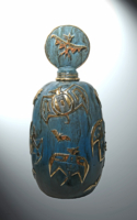 Jammey Huggins bronze blue gold with bat motif on bottle American Plains Artists